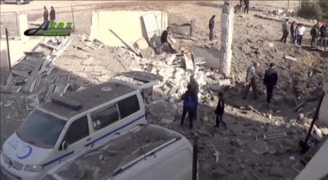 People gather near what is said to be a hospital damaged by missile attacks in Azaz, Aleppo, Syria, February 15, 2016 in this still image taken from a video on a social media website. REUTERS/Social Media Website via Reuters TV