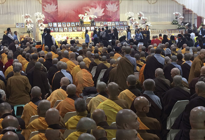 Relatives, religious leaders and government officials attend a memorial for the victims of the collapsed building complex caused by an earthquake in Tainan, Taiwan, on Friday, February 12, 2016. Photo: AP