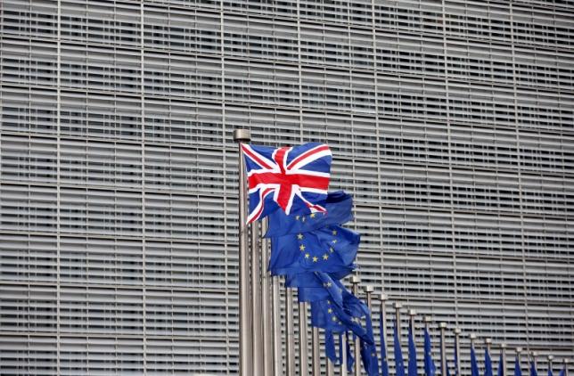 A Union Jack flag flutters next to European Union flags ahead of a visit from Britain's Prime Minister David Cameron at the EU Commission headquarters in Brussels, Belgium, in this January 29, 2016 file photo. REUTERS/Francois Lenoir/Files