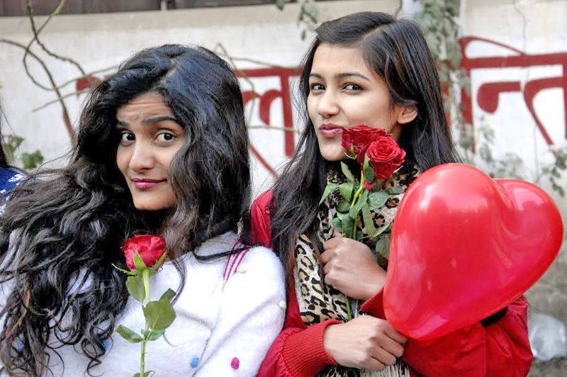 Girls pose for a photo during the Valentine's  Day celebration programme at Ratna Rajya Laxmi Campus, Exhibition Road in Kathmandu on Sunday. Photo:  Bal Krishna Thapa Chhetri 