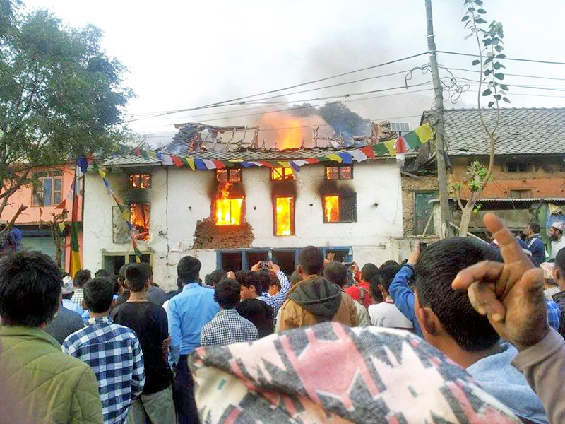Locals struggling to douse a fire brokenout in Mahadev Besi of Dhading district on Sunday, February 21, 2016. Photo: Keshav Adhikari