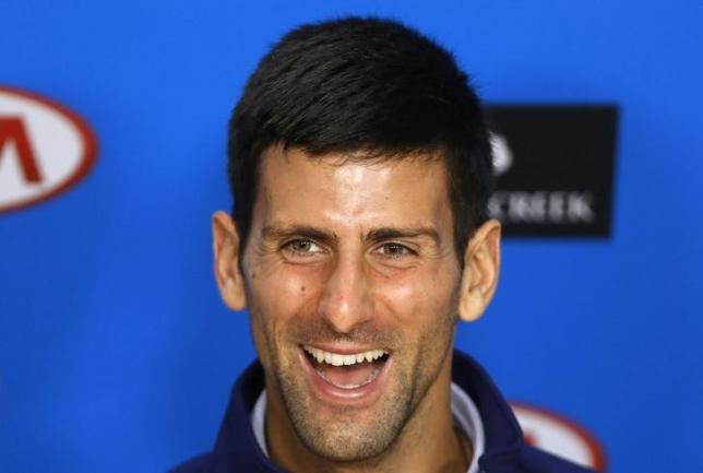 Serbia's Novak Djokovic smiles during a news conference after winning the men's singles final match at the Australian Open tennis tournament at Melbourne Park, Australia, January 31, 2016. Photo: Reuters