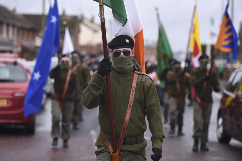 Masked members of Republican Sinn Fein commemorate the 100 year anniversary of the Irish Easter Rising in Lurgan, Northern Ireland on March 26, 2016. Photo: Reuters