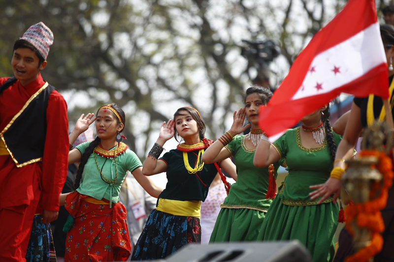 Girls dressed in traditional attires performing a cultural dance during the inaugural session of the 13th general convention of the Nepali Congress party in Khulamanch, Kathmandu, on Thursday, March 3, 2016. Photo: Skanda Gautam 