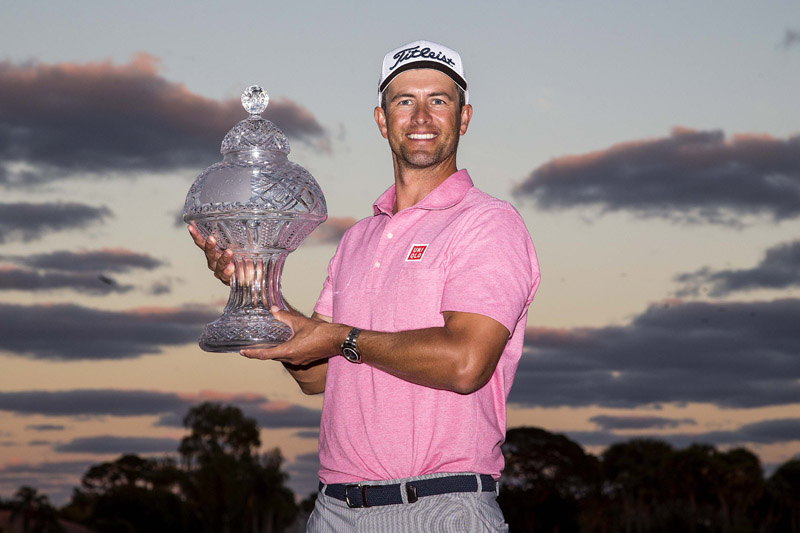 Adam Scott of Australia holds the trophy after winning the Honda Classic in Miami on Sunday. Photo: Reuters