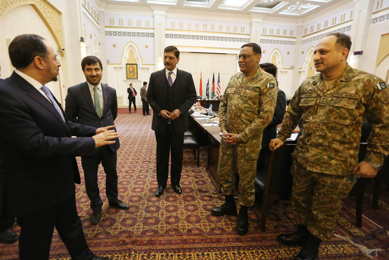 Afghan Foreign Minister Salahuddin Rabbani (left) talks with Pakistani delegates during a meeting to discuss a road map for ending the war with the Taliban at the Presidential Palace in Kabul, Afghanistan, on Tuesday, February 23, 2016. Photo: AP