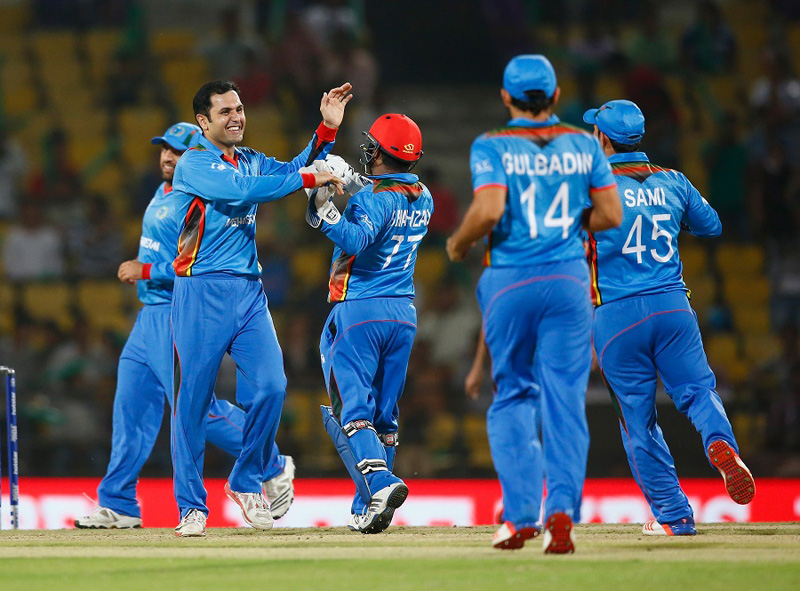 Afghanistan's Mohammad Nabi (second from left) celebrates with teammates after taking a wicket against Hong Kong during their ICC World T20 match in Nagpur on Thursday. Photo: ICC