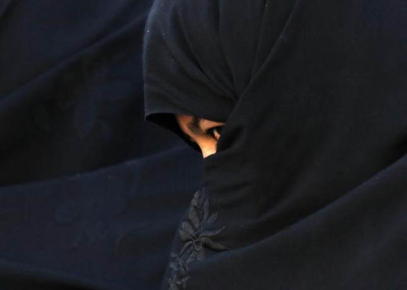 An Afghan woman attends an election campaign of Afghan presidential candidate Abdullah Abdullah in Chaghchran capital of Ghor province June 2, 2014. Photo: Reuters