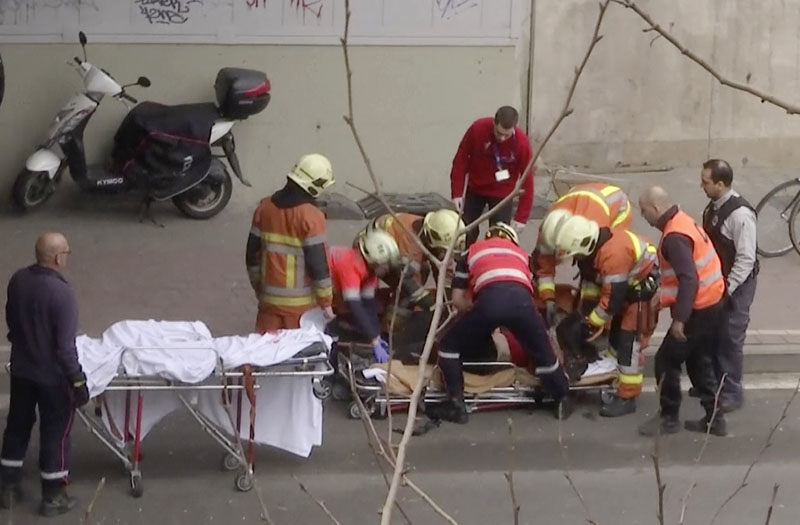 The videograb shows, emergency rescue workers stretcher an unidentified person at the site of an explosion at a metro station in Brussels, Belgium, on Tuesday, March 22, 2016. Photo: APTN via AP