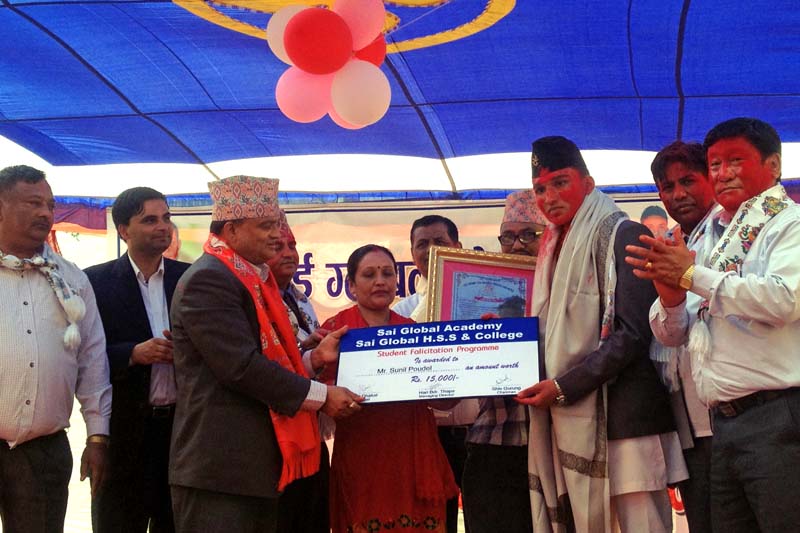 Rupandehi CDO Bishnu Prasad Dhakal felicitating Sunil Paudel, taekwondo bronze medallist of the 12th South Asian Games on Tuesday, March 15, 2016. Photo: THT