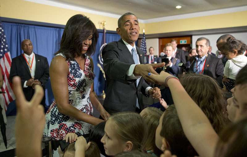 President Barack Obama (centre), first lady Michelle Obama greet children and families of Embassy personnel during an event at Melia Habana Hotel, in Havana, Cuba, on Sunday, March 20, 2016. Photo: AP
