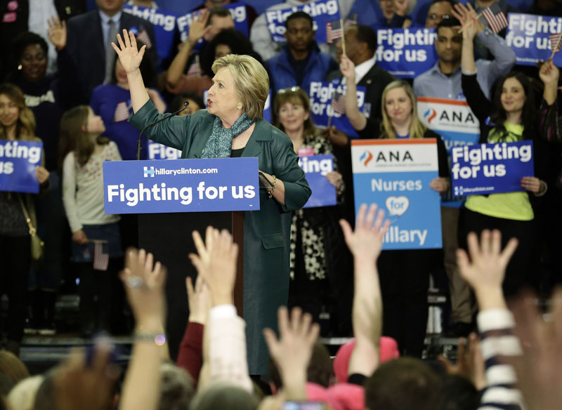 Democratic presidential candidate Hillary Clinton asks audience members to raise their hands if they have outstanding student loans, on Tuesday, March 22, 2016, during a campaign rally at Rainier Beach High School in Seattle. Photo: AP