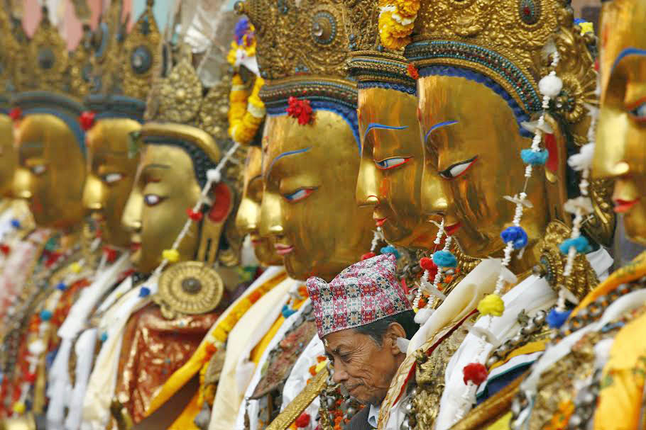 A devotee is seen among the Dipankara Buddha idols during the Samyak Mahadan festival in Patan, on Saturday, March 11, 2016. The festival is celebrated once in five years. Photo: Skanda Gautam
