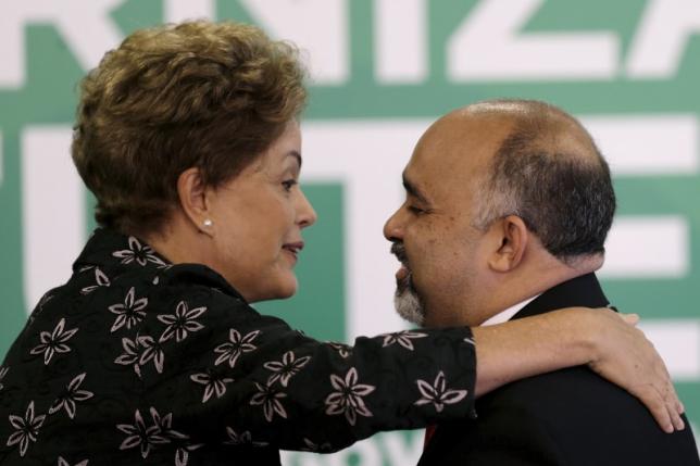 Brazil's President Dilma Rousseff (L) greets Sports Minister George Hilton during a ceremony to announce measures to modernize Brazilian soccer at the Planalto Palace in Brasilia, Brazul, in this March 19, 2015 file photo. REUTERS/Ueslei Marcelino/Files