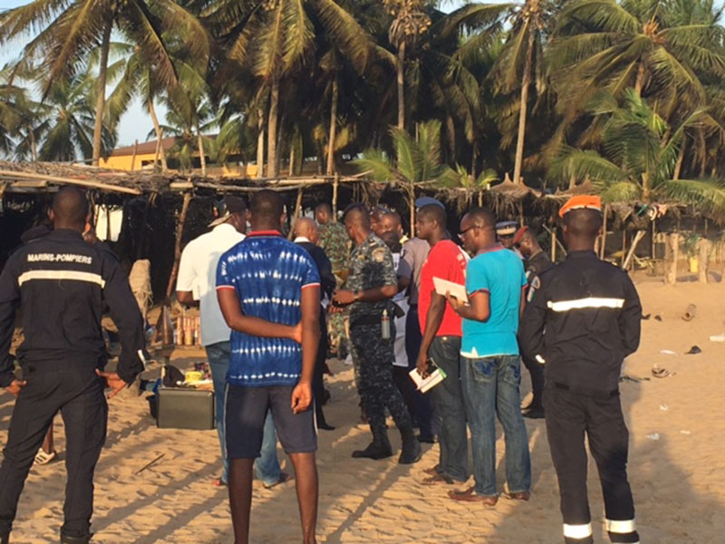Security forces gathering around the scene where gunmen attacked people in Grand Bassam, Ivory Coast, on March 13, 2016. Photo: AP