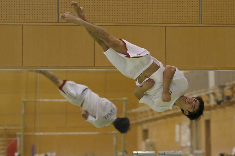 Kenzo Shirai, who won an individual gold in floor exercises of the World Gymnastics Championships in 2015, takes part in a training session at the National Training Centre in Tokyo, Japan, on February 26, 2016. Photo: Reuters