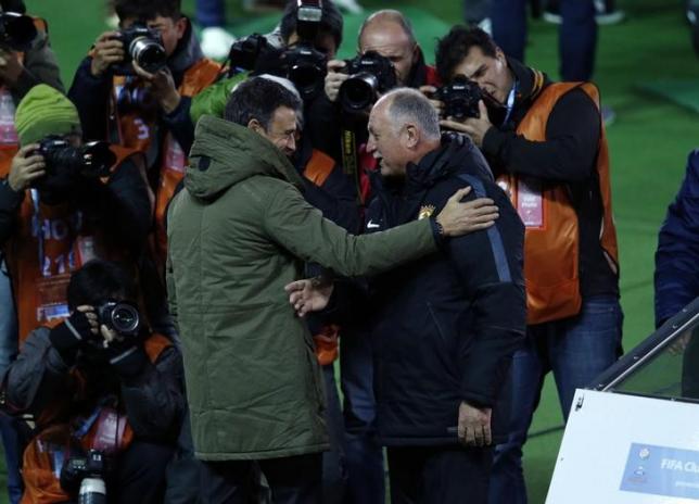 Barcelona's head coach Luis Enrique (L) talks with Guangzhou Evergrande's head coach Luiz Felipe Scolari before their Club World Cup semi-final soccer match in Yokohama, south of Tokyo, Japan December 17, 2015. REUTERS/Yuya Shino/Files