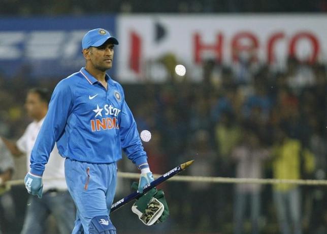 India's captain Mahendra Singh Dhoni walks off the ground after winning the second one-day international cricket match against South Africa in Indore, India, October 14, 2015. REUTERS/Danish Siddiqui/Files