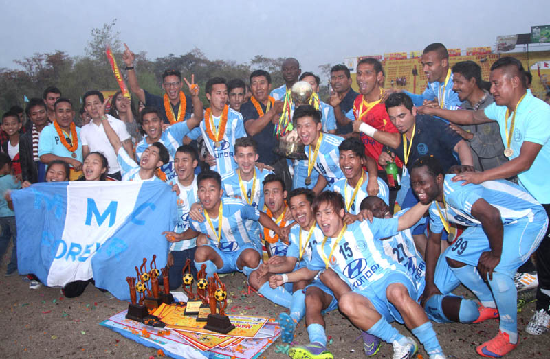 Manang Marshyangdi Club players and officials celebrate after winning the 18th International Invitational Red Bull Buddha Subba Gold Cup Football Tournament in Dharan on Saturday. Photo: THT