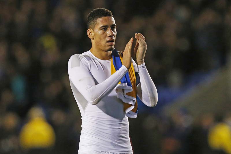 Manchester United's Chris Smalling applauds fans at the end of their game with Shrewsbury Town in the FA Cup Fifth Round at the Greenhous Meadow on February 22, 2016. Photo: Reuters