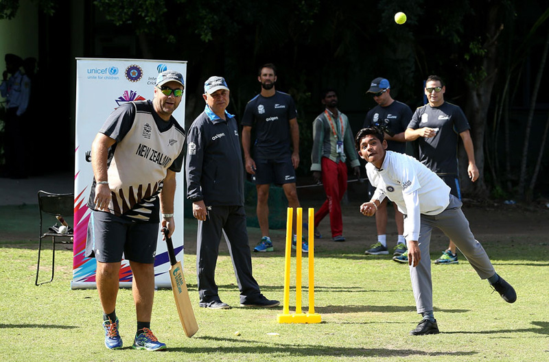 New Zealand cricketers play match with local children during a practice session in Mohali on Monday.