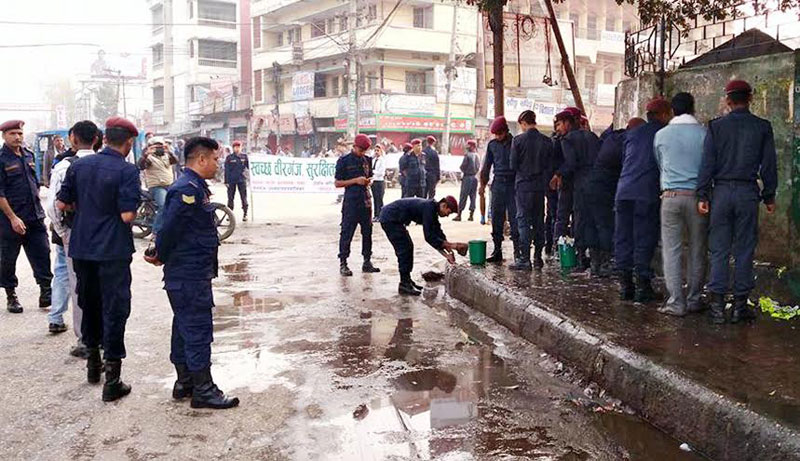 Police personnel cleaning public area in Birgunj on Saturday, March 05, 2016. Photo: Ram Sarraf 