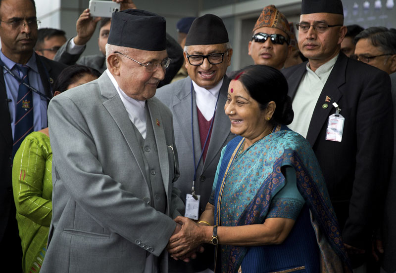 Nepal's Prime Minister KP Sharma Oli (left) is greeted by Indian Minister of External Affairs, Sushma Swaraj, as he arrives in New Delhi, India, on Friday, February 19, 2016. Photo: AP