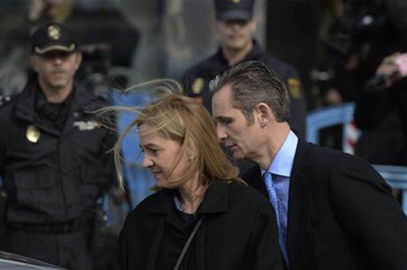 FILE - In this Feb. 9, 2016 file photo, Spain's Princess Cristina and her husband Inaki Urdangarin, leave a makeshift courtroom after attending a corruption trial, in Palma de Mallorca, Spain. Photo: AP