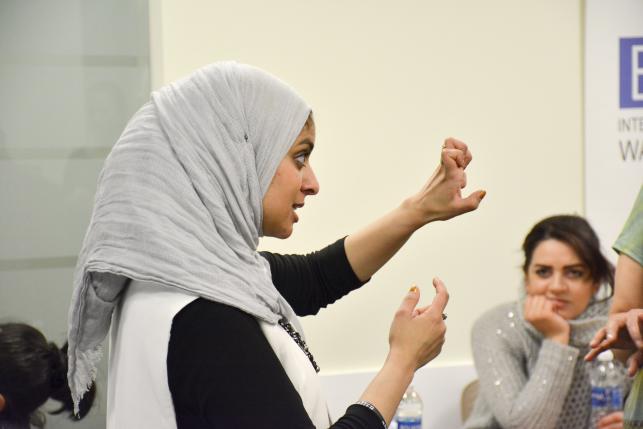 Egyptian-American community activist Rana Abdelhamid demonstrates how to hold one's fist for an attack punch during a self-defense workshop designed for Muslim women in Washington, DC, March 4, 2016 in this handout photo provided by Rawan Elbaba. Picture taken March 4, 2016. REUTERS/Rawan Elbaba/Handout via Reuters