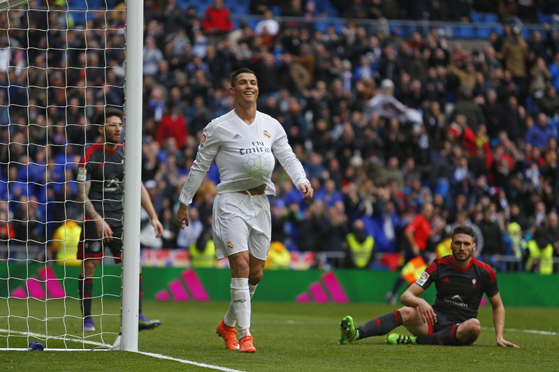 Real Madrid's Cristiano Ronaldo (centre) celebrates after scoring a goal against Celta during a Spanish La Liga soccer match between Real Madrid and Celta Vigo at the Santiago Bernabeu stadium in Madrid, on Saturday, March 5, 2016. Photo: AP