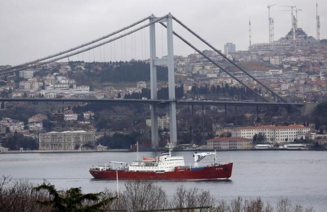 The Russian Navy's transport ship Yauza, with the Bosphorus bridge in the background, sets sail in the Bosphorus, on its way to the Mediterranean Sea, in Istanbul, Turkey February 20, 2016. REUTERS/Murad Sezer/Files