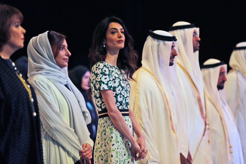 Amal Alamuddin Clooney, writer, human rights activist, 3rd left, listens to the national anthem during the opening ceremony of the International Government Communications Forum in Sharjah, United Arab Emirates, Sunday, March 20, 2016. Photo: AP