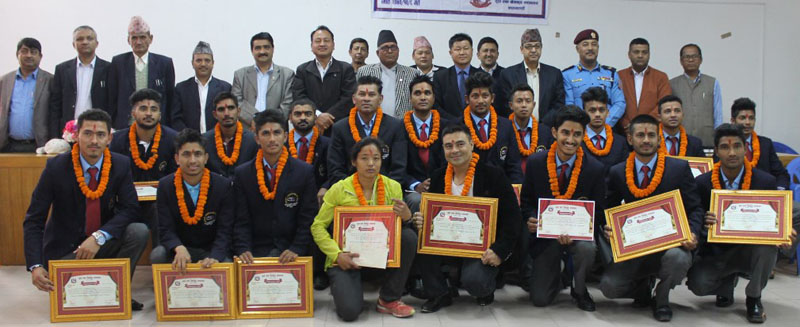 U-19 cricket team members, ultra runner Mira Rai and bodybuilder Rujesh Shahi with officials at a felicitation programme in Lalitpur on Monday. Photo: THT