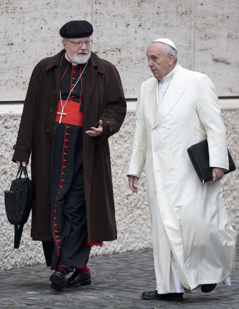 FILE - Pope Francis (right) talks with the head of a sex abuse advisory commission, Cardinal Sean Patrick O'Malley, of Boston, as they arrive for a special consistory in the Synod hall at the Vatican, on February 13, 2015. Photo: AP
