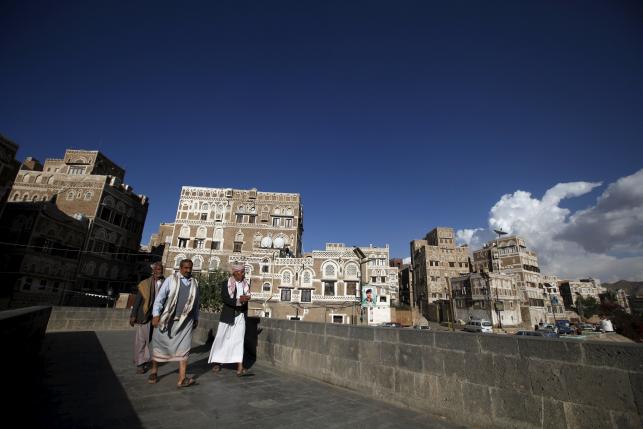 People walk in the old quarter of Yemen's capital Sanaa March 8, 2016. REUTERS/Khaled Abdullah