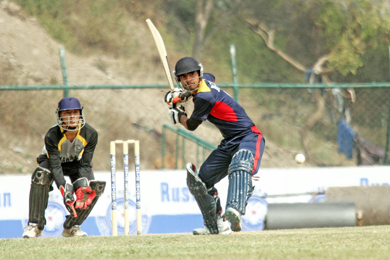 A player closely look at a ball during Ruslan Cup Cricket Tournament at TU Cricket Grounds on Thursday, March 3, 2016. Photo: THT