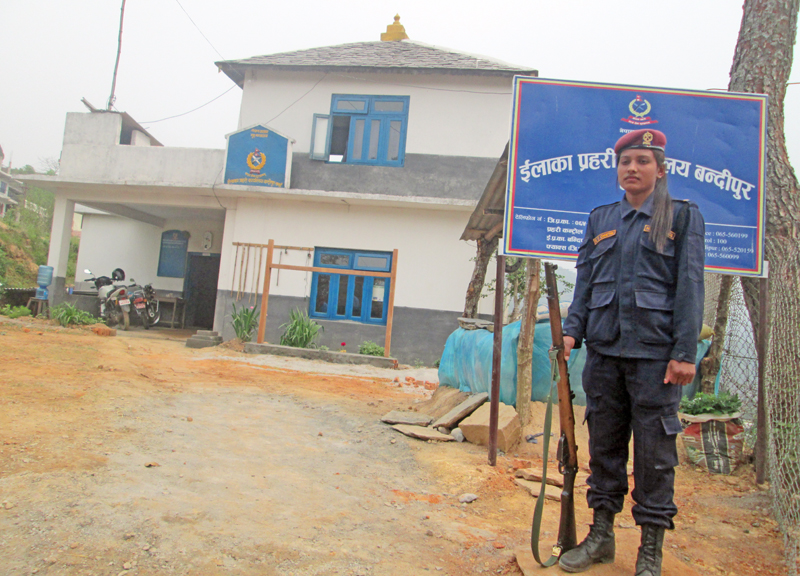 An on-duty female constable guarding the Area Police Office, in Bandipur, Tanahun, on Tuesday, March 29, 2016. Photo: THT