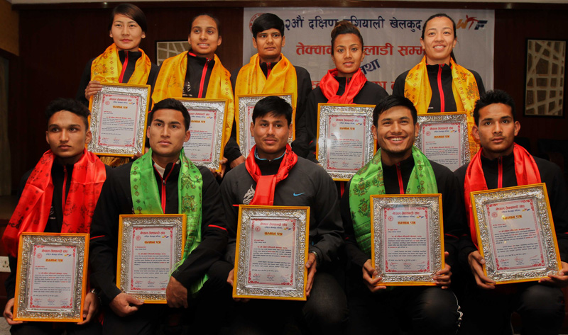 The 12th South Asian Games medal winning taekwondo players pose for a group photo after being felicitated by Nepal Taekwondo Association in Kathmandu on Monday. Photo: THT