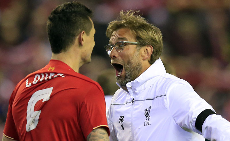 Liverpool's Dejan Lovren (left) and Liverpool's head coach Juergen Klopp celebrate after winning the Europa League quarterfinal second leg soccer match between Liverpool  FC and Borussia Dortmund in Liverpool, England, Thursday, April 14, 2016 . (AP Photo/Jon Super)