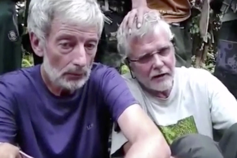 Canadians John Ridsdel (right) and Robert Hall. Canada's Prime Minister Justin Trudeau confirmed that the decapitated head of a Caucasian male recovered on Monday, April 25, 2016, in the southern Philippines belongs to Ridsdel, who was taken hostage by Abu Sayyaf militants in September 2015. Photo: Militant Video via AP Video