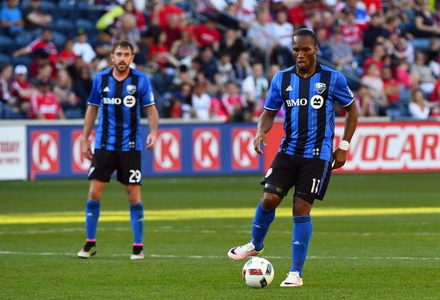Apr 16, 2016; Chicago, IL, USA; Montreal Impact forward Didier Drogba (11) kicks the ball against the Chicago Fire  during the second half at Toyota Park. Montreal Impact defeat the Chicago Fire 2-1. Mandatory Credit: Mike DiNovo-USA TODAY Sports