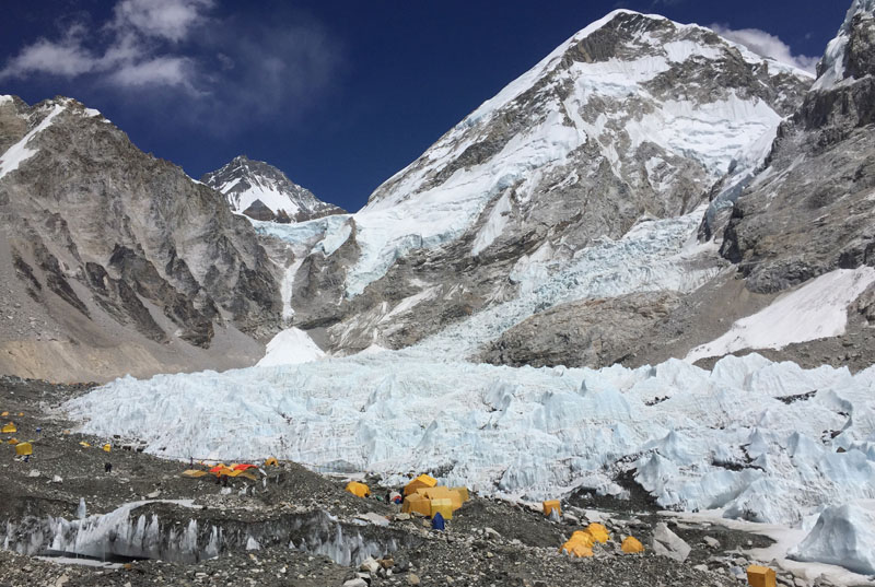 FILE: Yellow and orange tents at Everest Base Camp, pitched on the edges of the Khumbu icefall in Nepal, on April 10, 2016. Photo: Karin Laub/AP