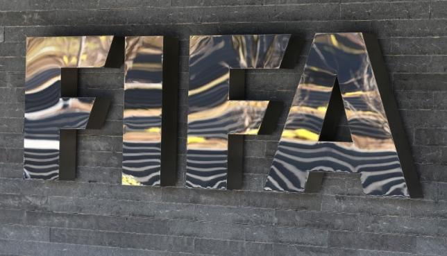The FIFA logo is seen at the FIFA headquarters in Zurich, Switzerland March 18, 2016. REUTERS/Ruben Sprich