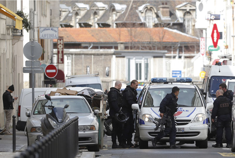 Police officers block a street after a gunman   fired shots near cafes targeted in last November's attacks, on Thursday April 7, 2016 in Paris. Photo: AP