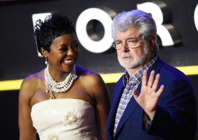 George Lucas and his wife Mellody Hobson arrive at the European Premiere of Star Wars, The Force Awakens in Leicester Square, London, December 16, 2015.       REUTERS/Dylan Martinez