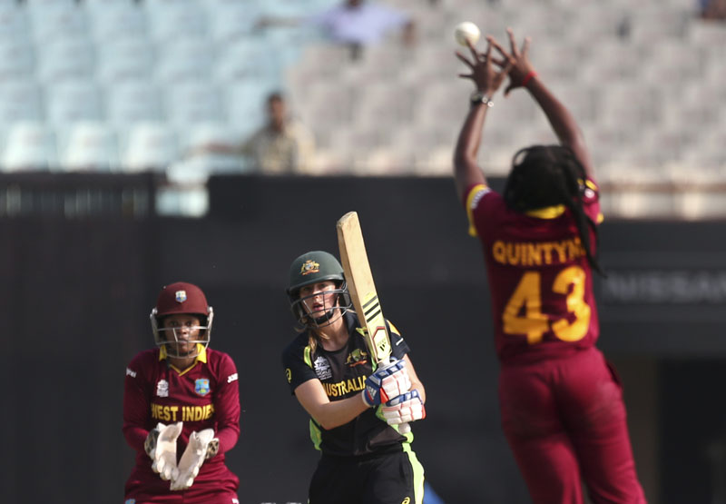 Australia's Ellyse Perry (centre) watches as  West Indies' Shaquana Quintyne tries to field a ball during the final of the ICC Women's World Twenty20 2016 cricket tournament at Eden Gardens in Kolkata, India, on Sunday, April 3, 2016. Photo: AP