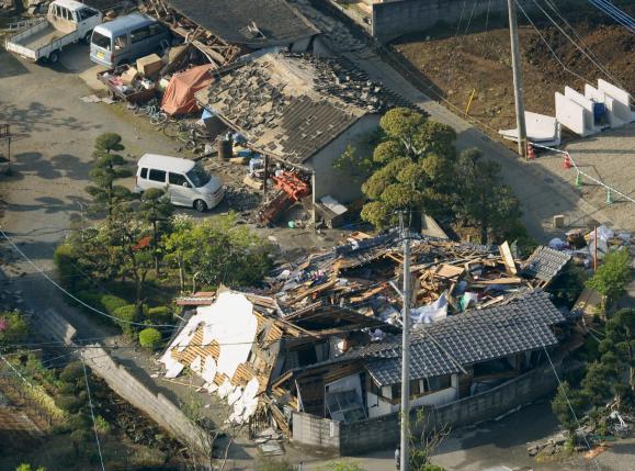 Collapsed houses caused by an earthquake are seen in Mashiki town, Kumamoto prefecture, southern Japan, in this photo taken by Kyodo April 15, 2016. Mandatory credit REUTERS/Kyodo