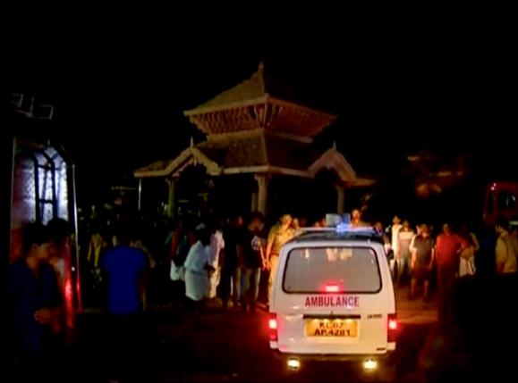 An ambulance is seen next to people after a fire broke out as people gathered for a fireworks display at a temple in Kollam in this still image taken from video April 10, 2016. REUTERS/ANI via REUTERS TV