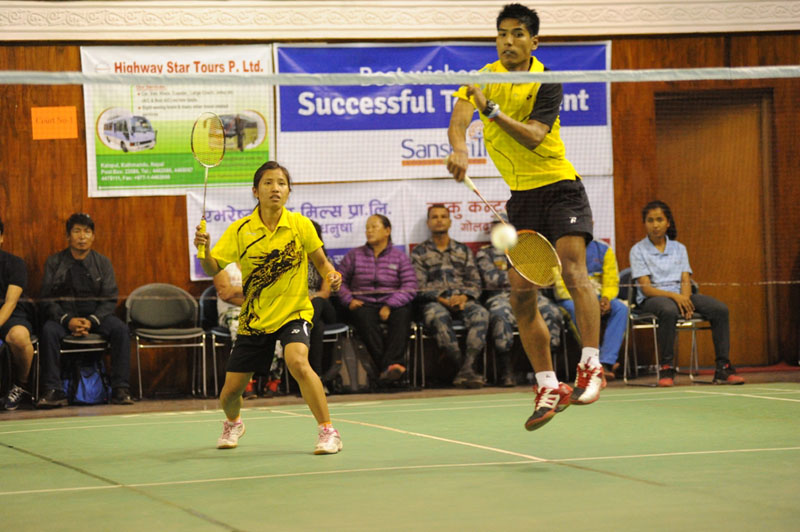 Tribhuvan Army Club's Nangsal Tamang and Ratnajit Tamang in action during their mixed doubles match of nthe 12th Nationwide Krishnamohan Memorial Open Badminton Tournament in Kathmandu on Wednesday. Photo: THT