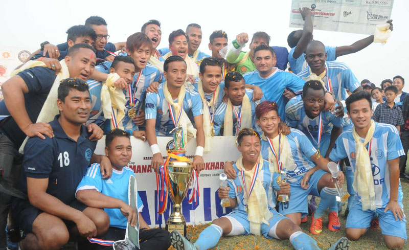 Players of the Manang Marsyangdi Club cheer after winning the 5th Manakamana Cable Car Pokhara Cup, at the Pokhara Stadium, in Kaski, on Saturday, April 23, 2016. Photo: THT